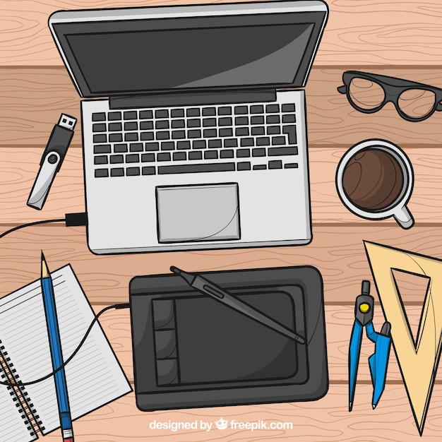 Free vector graphic design workspace background in hand drawn style