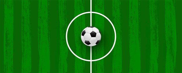 Green football field made of brush stroke with realistic soccer ball Banner template for sport tournaments and competitions