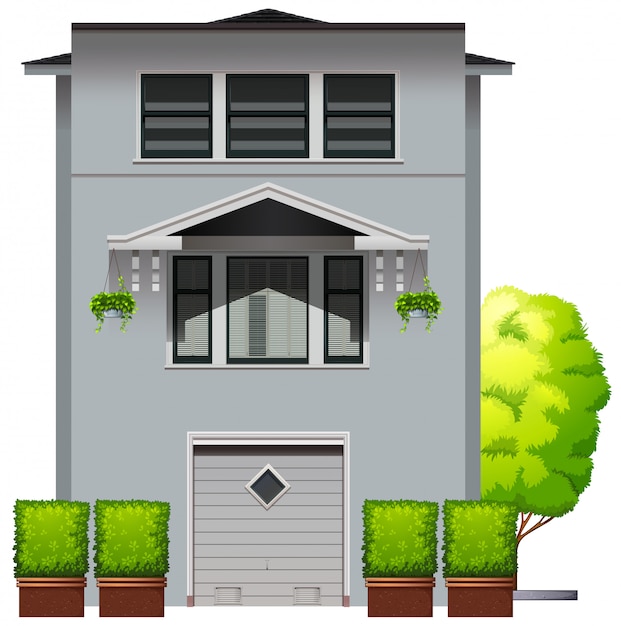 grey House with plants and tree