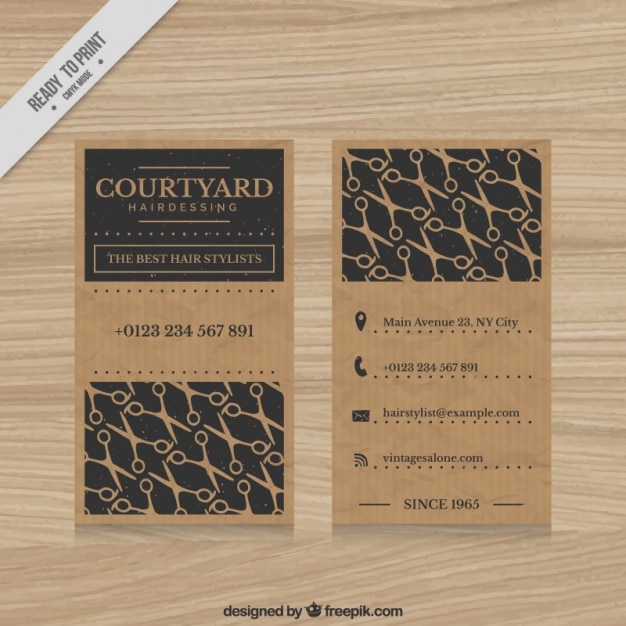 Free vector hairdressing card with scissors pattern