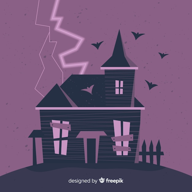 Free Vector halloween haunted house background in flat design