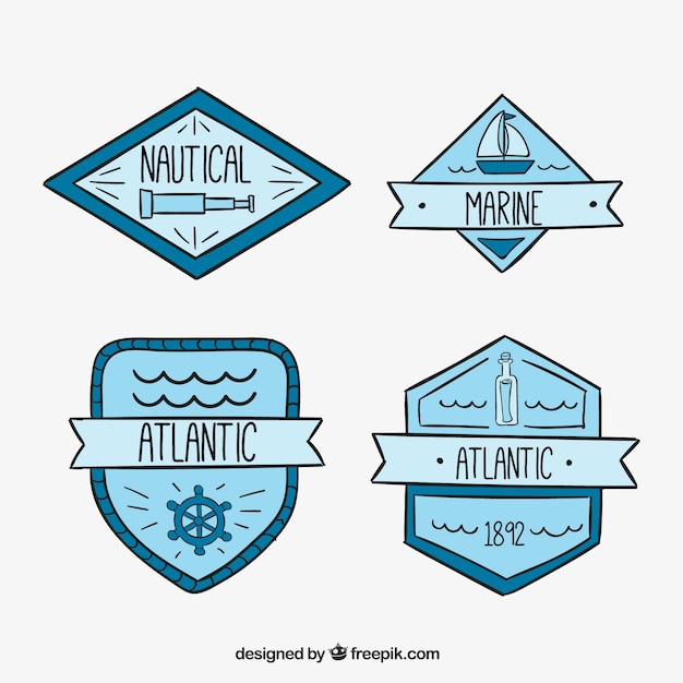 Free vector hand-drawn badges with nautical elements in blue tones