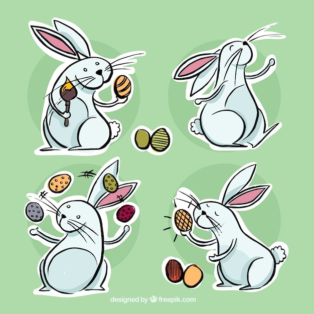 Free Vector hand drawn easter bunnies labels