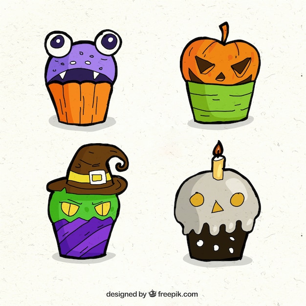 Free Vector hand drawn halloween cupcakes