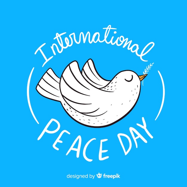 Free Vector hand drawn peace day with a dove