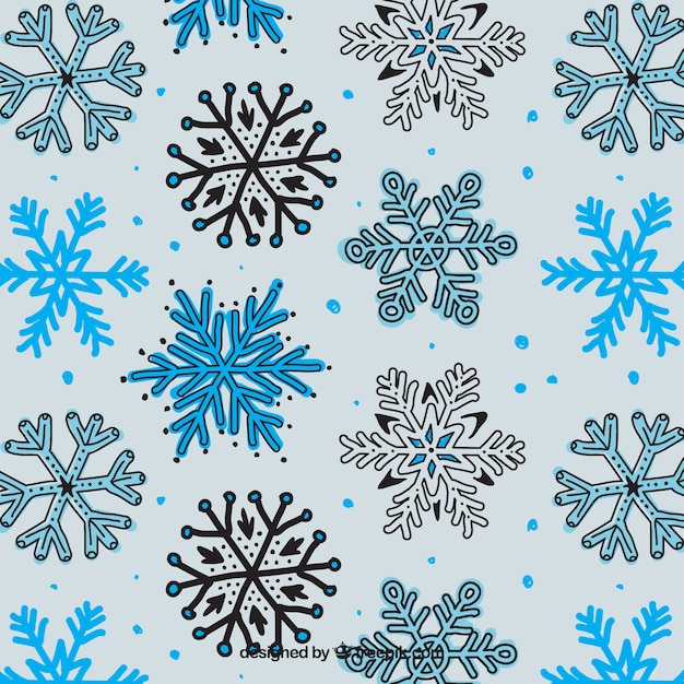 Free vector hand drawn snowflakes pattern