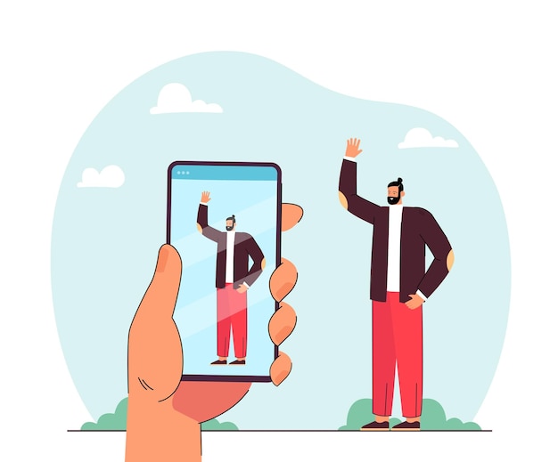 Free Vector hand holding phone and taking photo of waving man. male character on smartphone screen flat vector illustration. technology, photography concept for banner, website design or landing web page