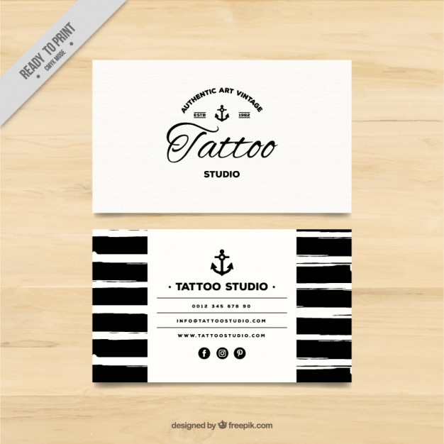 Hand painted business card for a tattoo studio