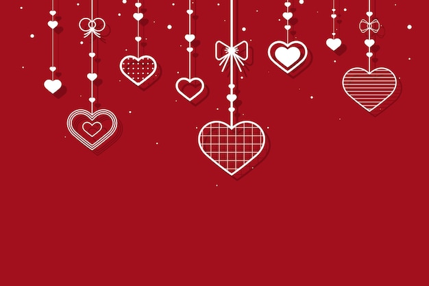 Hanging hearts on red background