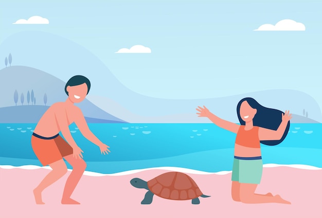 Happy cute kids playing with turtle on beach