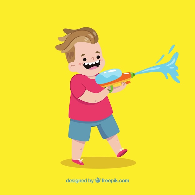 Happy kid playing with water gun 