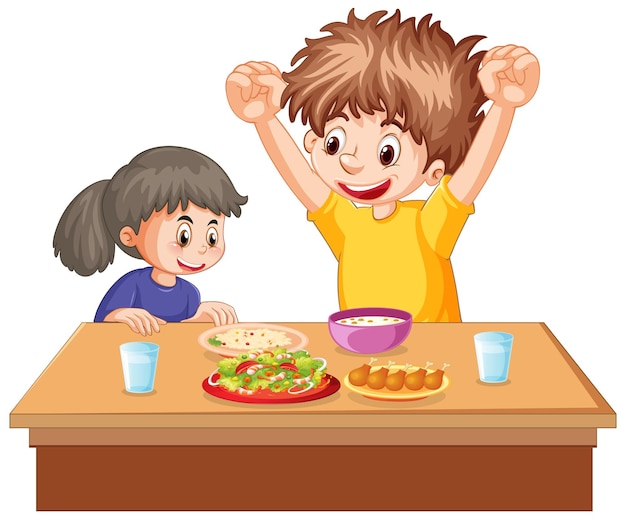 Happy kids eating on the table