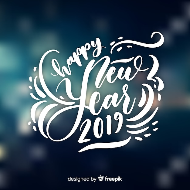 Happy new year 2019 composition with white lettering over blurry background