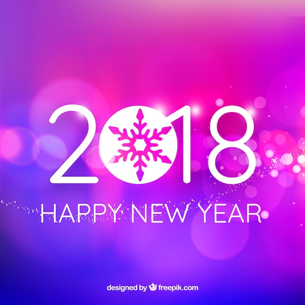 Happy new year background in pink and purple with a bokeh effect