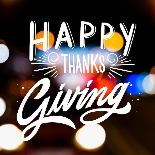 Happy thanksgiving lettering on blurred background