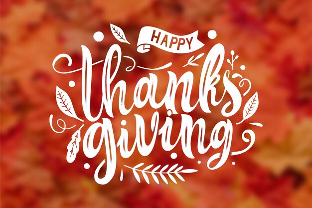 Happy thanksgiving lettering on blurred background