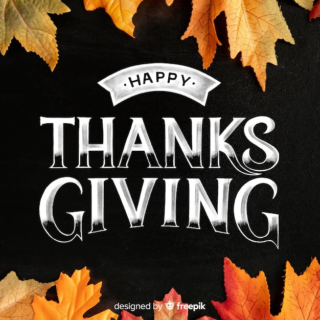 Happy thanksgiving lettering with dried canadian leaves