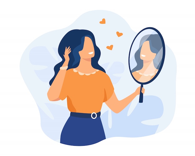 Happy woman looking at herself in mirror