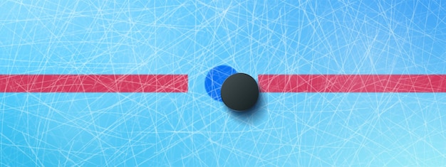 Hockey puck on blue ice rink top view background