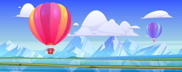 Hot air balloons fly above mountain landscape with lake and green meadows in valley.