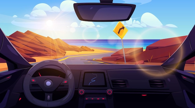 Inside car view on desert road to sea shore landscape Turn sign on highway for direction drive to ocean beach coast Steering control with navigation interface and windscreen scene on water and rock