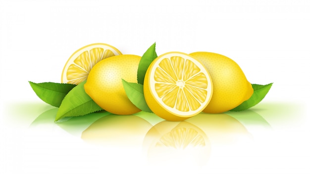 Lemons and green leaves isolated on white