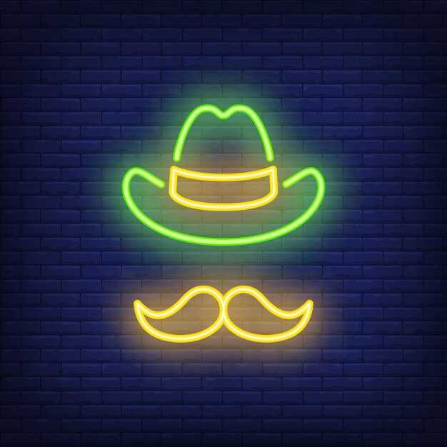 Leprechaun hat and moustaches for St. Patricks Day on brick background. 