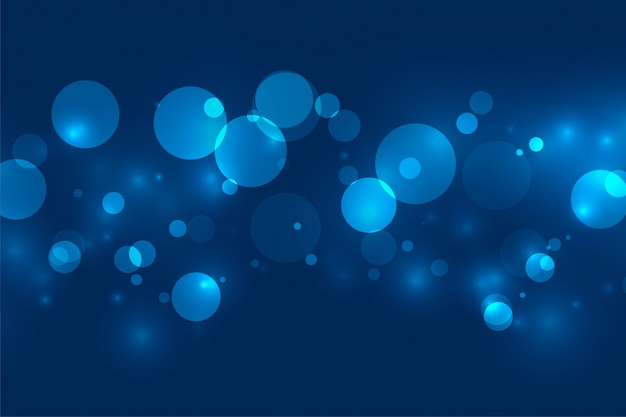 Magical blue bokeh shimmer lights background 