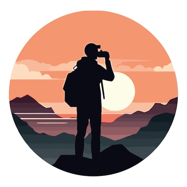 Man standing on mountain peak watching sunset