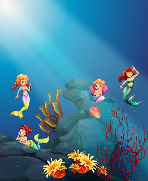 Mermaids swimming under the ocean