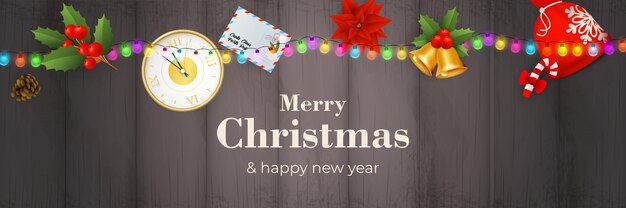 Merry Christmas banner with garland on grey wooden ground