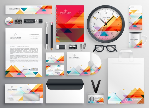 Free Vector modern set of brand stationery items with abstract shapes