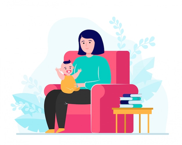 Mother sitting in armchair and holding little baby