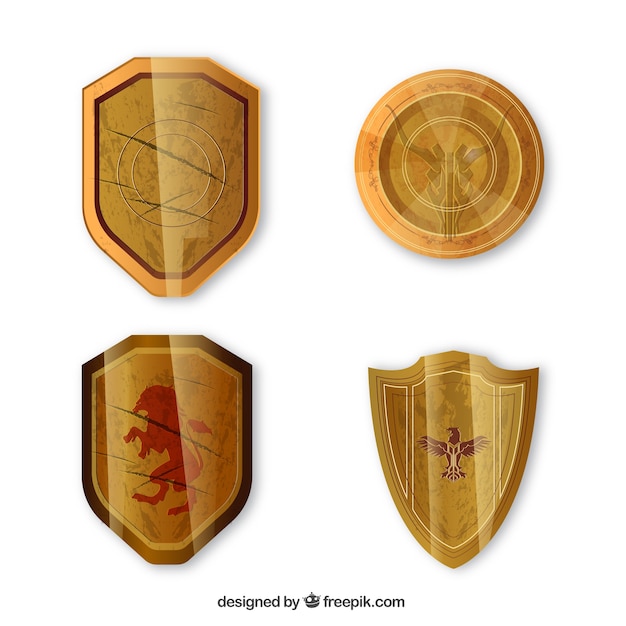 Free vector pack of four medieval golden shields