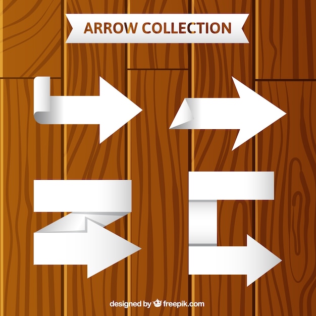 Free Vector pack of four white arrows with geometric shapes