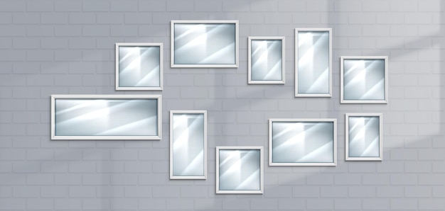 Picture frames on white brick wall