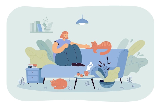 Free Vector positive lady sitting on cozy sofa with cats. cartoon illustration