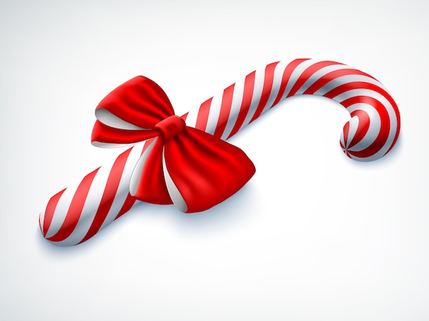 Realistic candy cane decorated with red bow on white