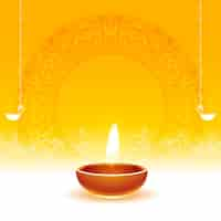 Free vector realistic glowing diwali diya yellow background with text space