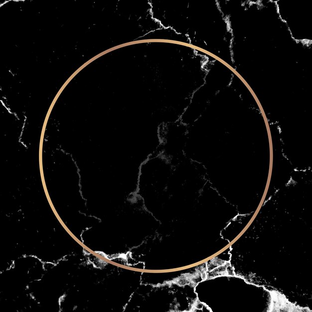 Round gold frame on black marble background