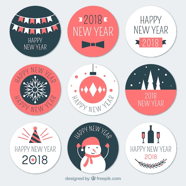 Round new year badges in white, pink, and dark blue