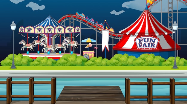 Free Vector scene with circus rides by the lake at night time