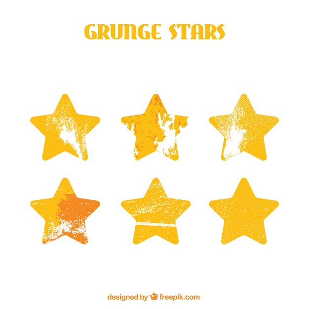 Set of golden stars in grunge style