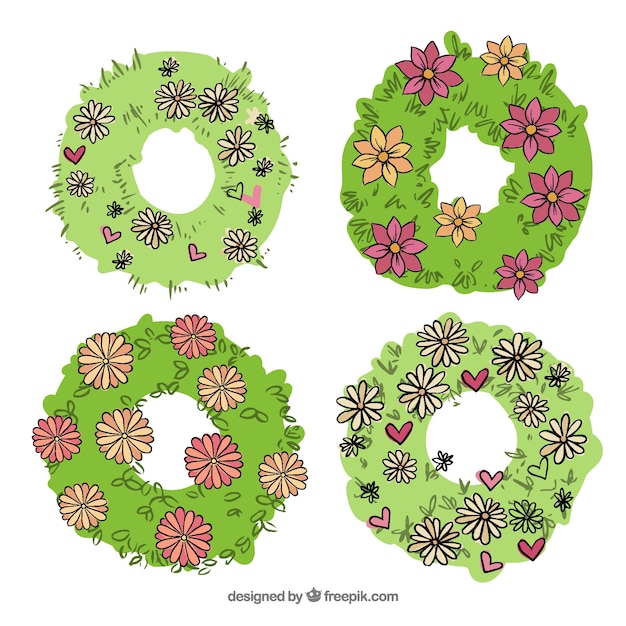 Set of hand-drawn spring wreaths with flowers