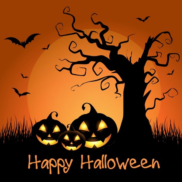 Spooky halloween background with tree and pumpkins