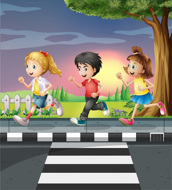 Three kids running along the road