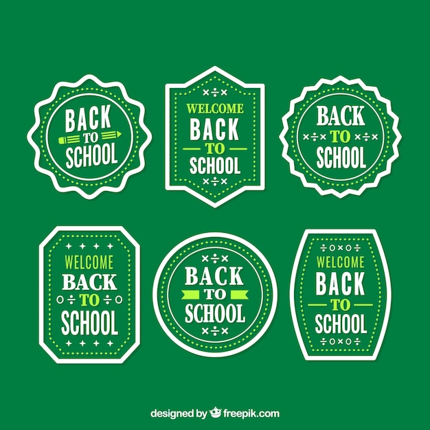 Free Vector vintage badges of back to school