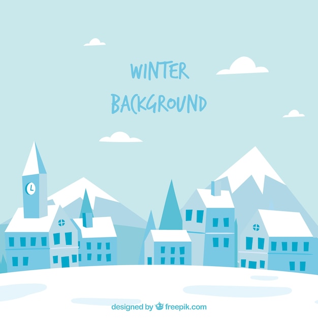 Winter background with a town by the mountains