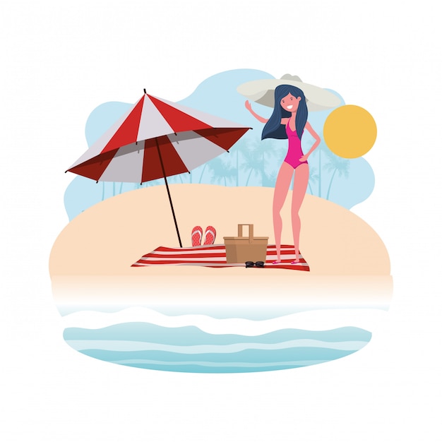 Woman with swimsuit on the beach and umbrella