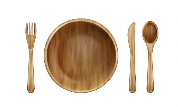 Free Vector wooden plate, fork, spoon and knife top view.